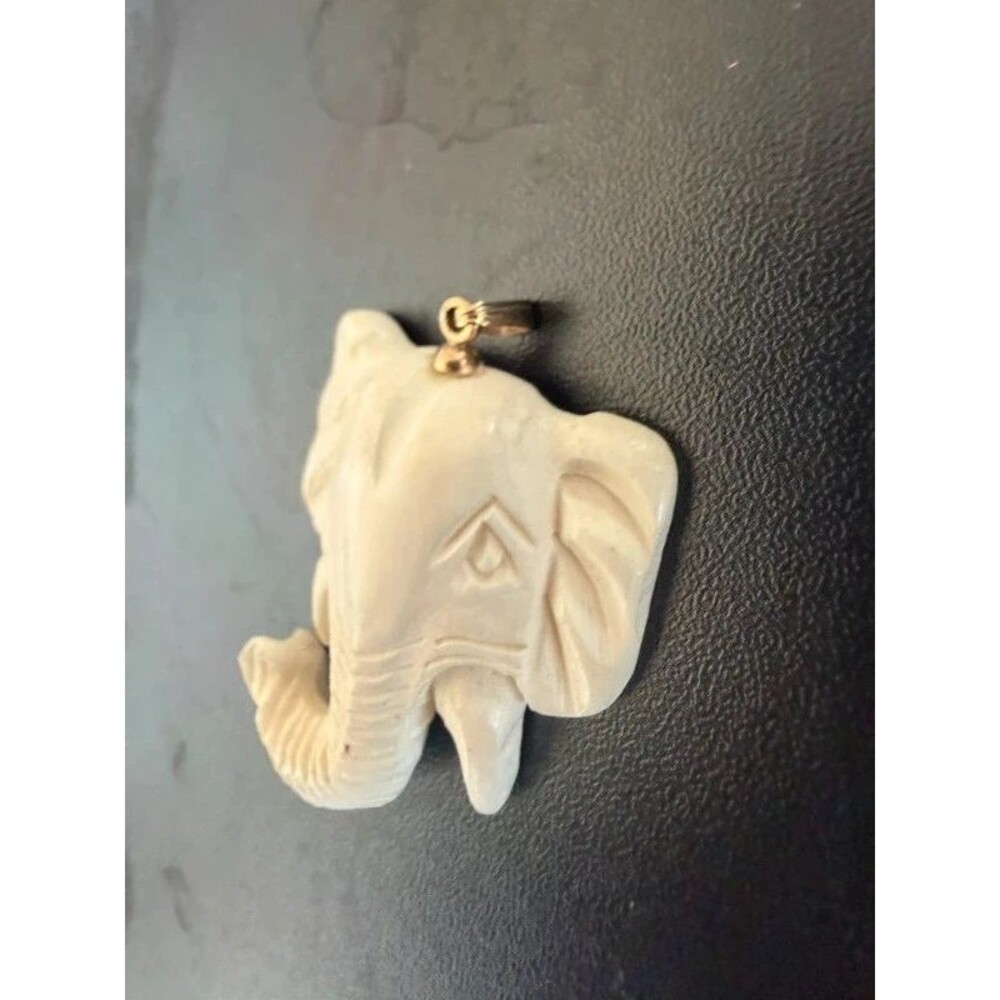 Vintage carved elephant-head pendant